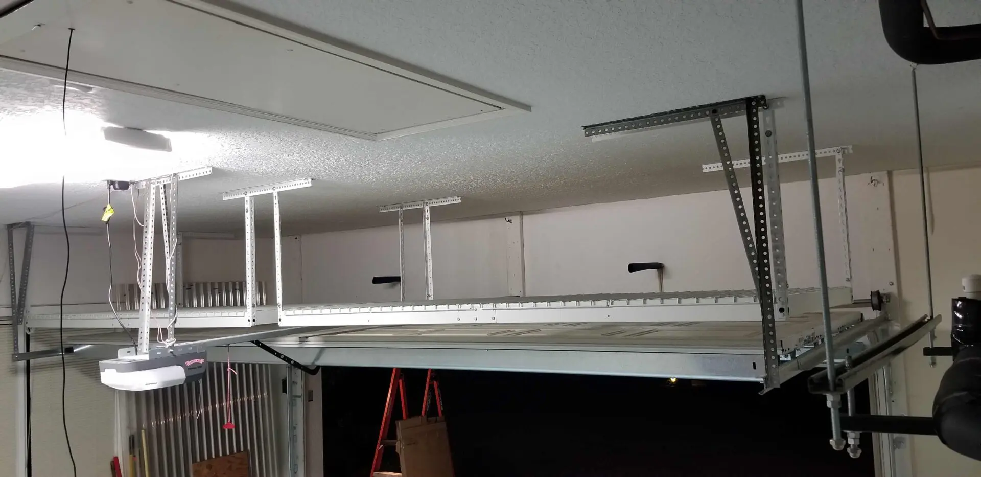 An overhead rack just above the garage door