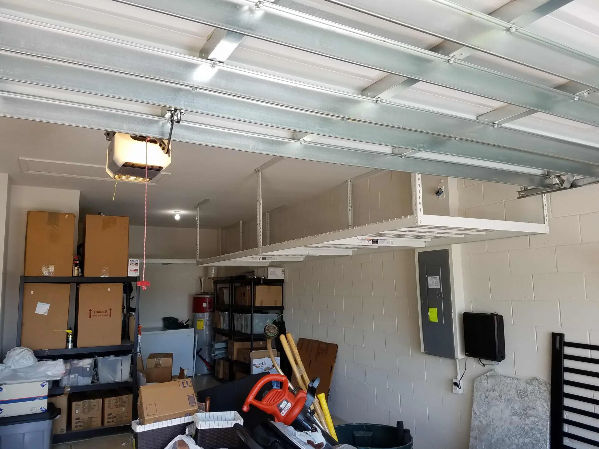 Newly installed overhead rack on one side of the garage