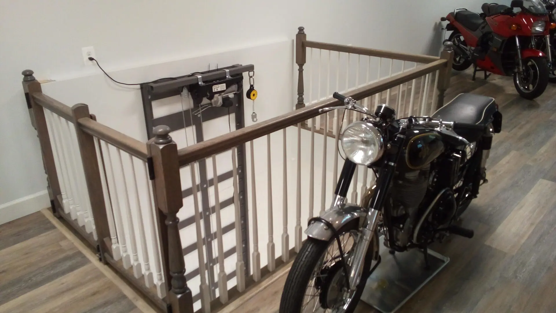Motorcycles on the garage’s second story and the lift on one side